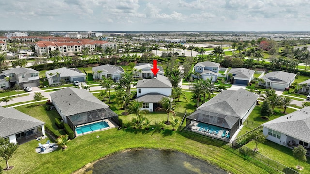 birds eye view of property with a residential view