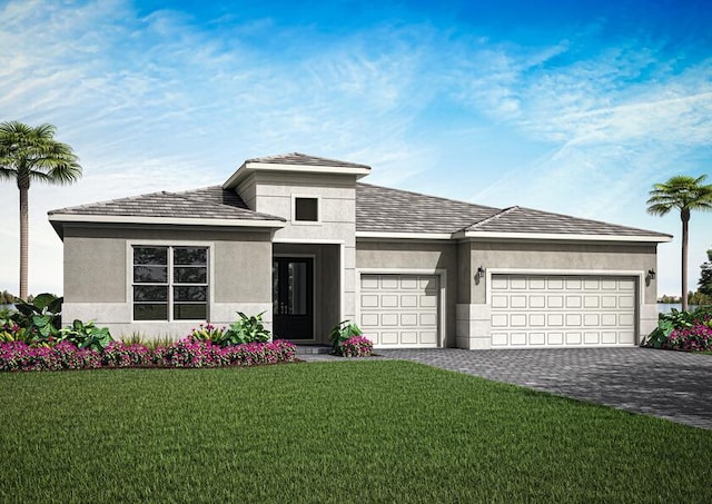 prairie-style home featuring a garage and a front yard