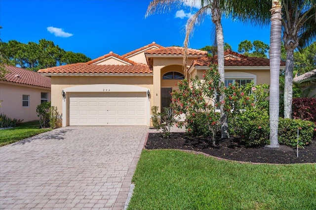 mediterranean / spanish-style home featuring a garage