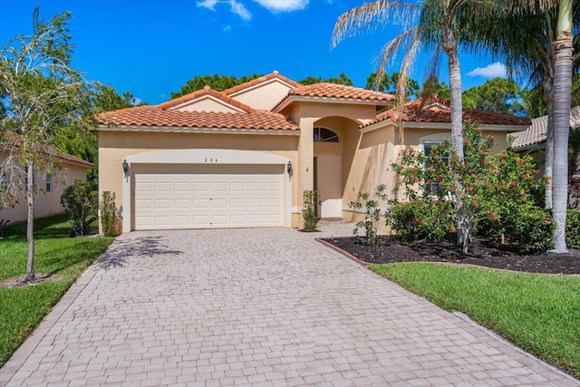 mediterranean / spanish-style house featuring a garage