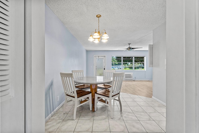 unfurnished dining area featuring baseboards, light tile patterned floors, ceiling fan with notable chandelier, a textured ceiling, and a wall mounted AC