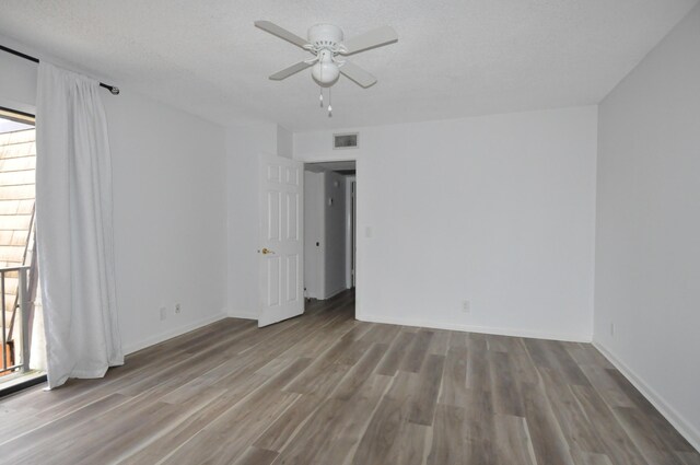 bathroom with a shower stall, visible vents, and vanity