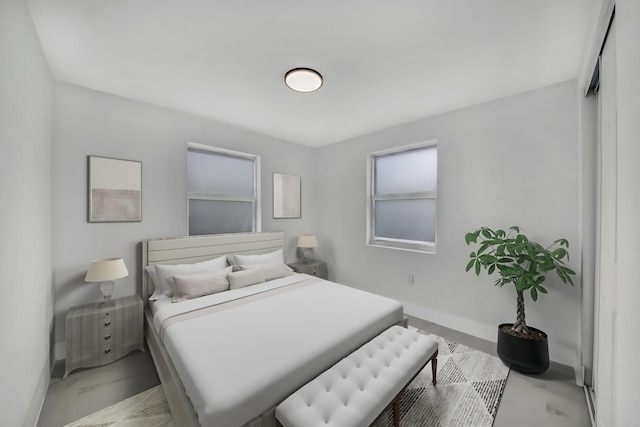 bedroom with marble finish floor and baseboards