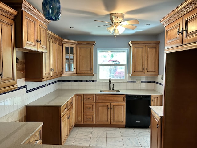 kitchen with ceiling fan, sink, black dishwasher, and decorative backsplash