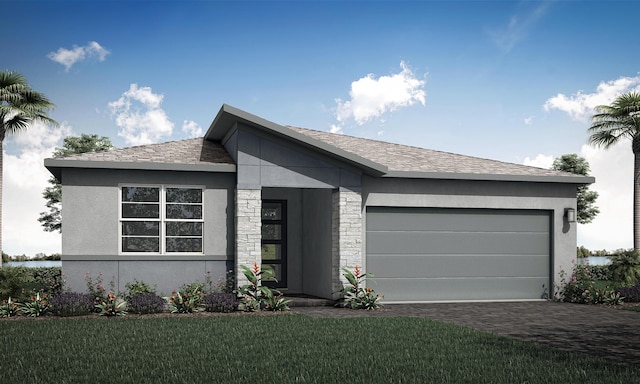 view of front of house with a garage and a front yard