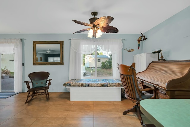 office space featuring ceiling fan and light tile patterned floors