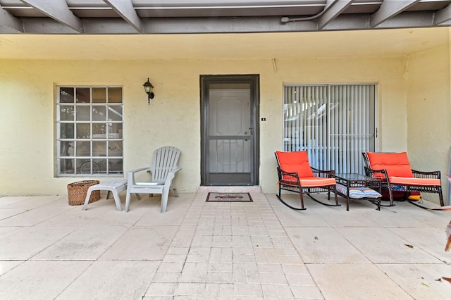 property entrance with a patio