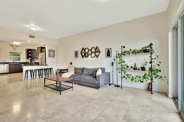 living room featuring visible vents