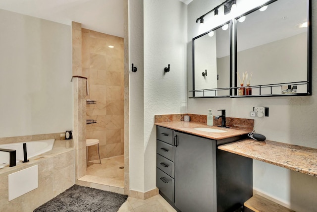 bathroom featuring a walk in shower, vanity, and a bath