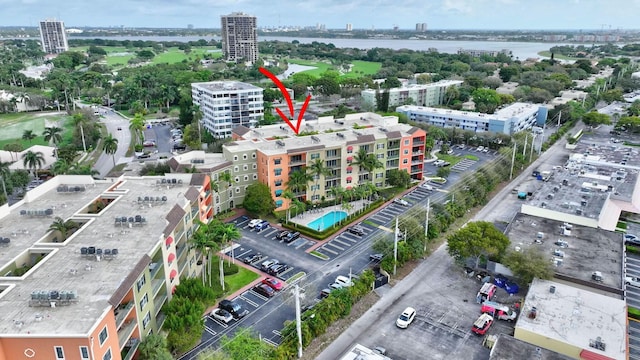 drone / aerial view with a water view and a view of city