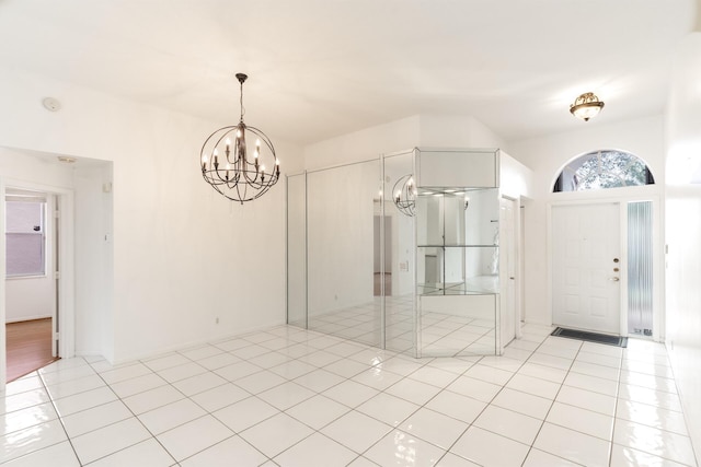 interior space featuring a chandelier and light tile patterned flooring