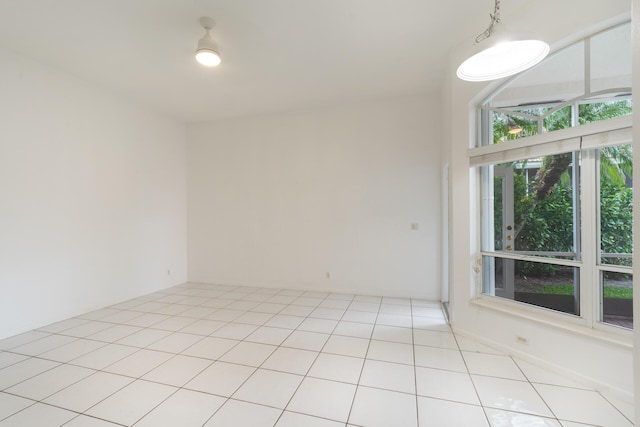 unfurnished room with light tile patterned floors