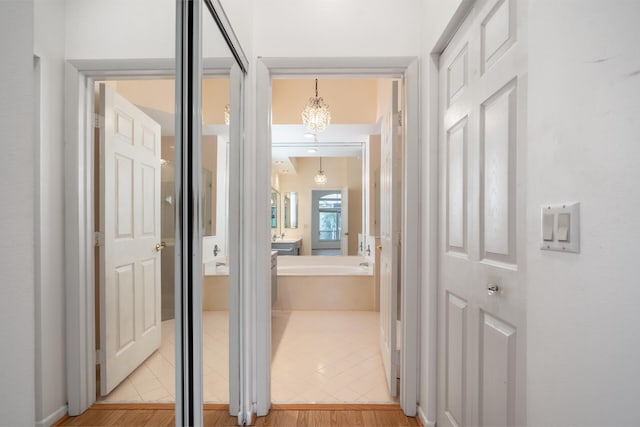 corridor with light wood finished floors