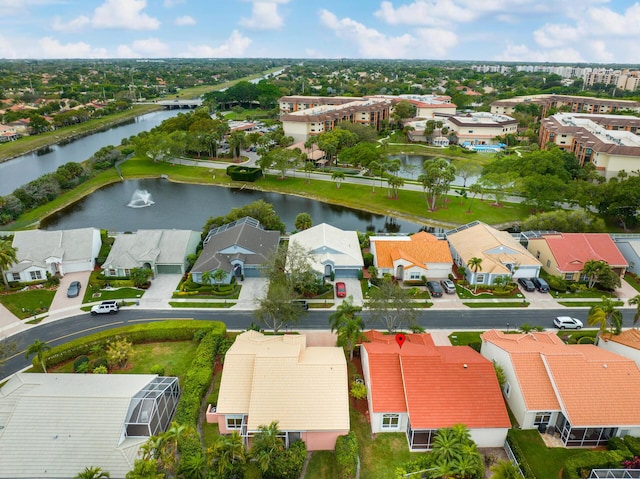 bird's eye view featuring a water view and a residential view