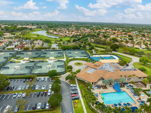 birds eye view of property featuring a water view and a residential view