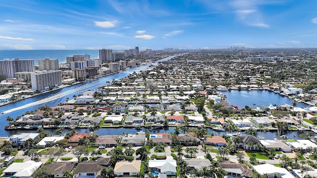 birds eye view of property with a residential view, a view of city, and a water view