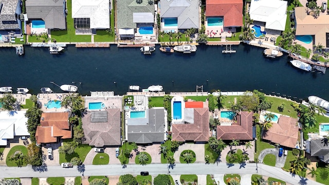 bird's eye view featuring a water view and a residential view