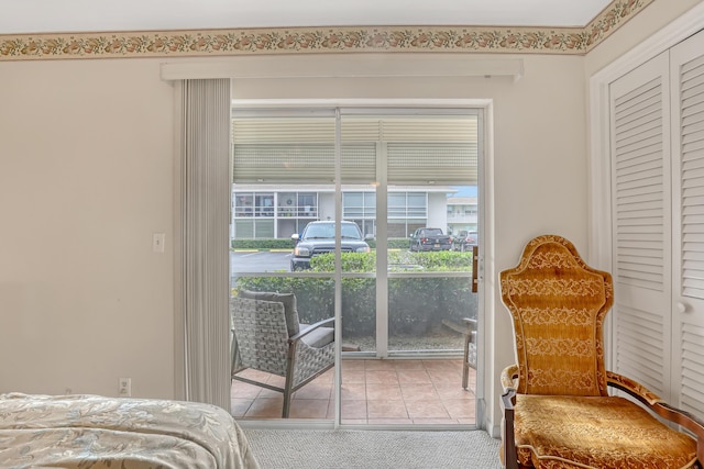 tiled bedroom featuring access to exterior