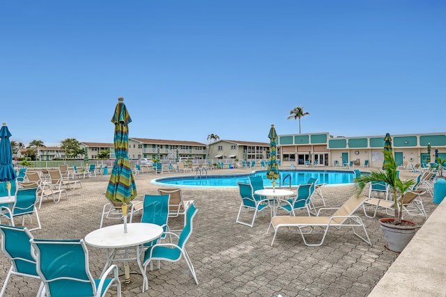 view of swimming pool with a patio