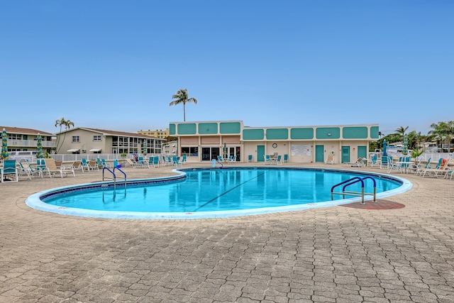 view of swimming pool with a patio