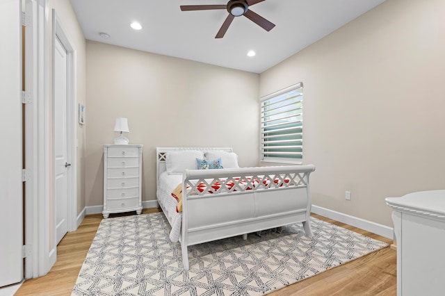 bedroom featuring recessed lighting, wood finished floors, and baseboards