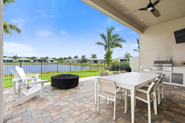 view of patio / terrace with ceiling fan, a fenced backyard, a grill, and outdoor dining area