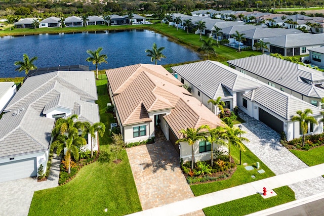 bird's eye view featuring a water view and a residential view