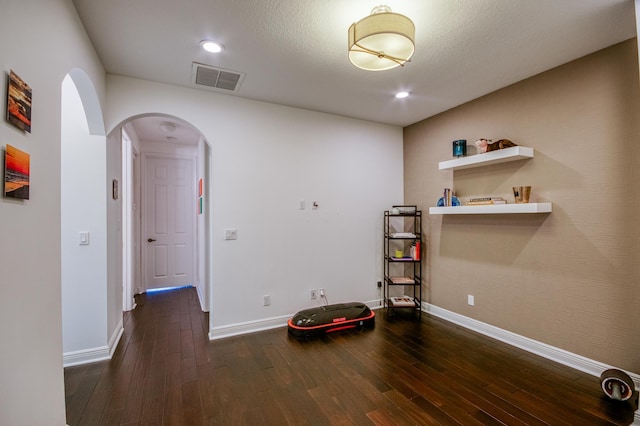 miscellaneous room featuring dark hardwood / wood-style floors