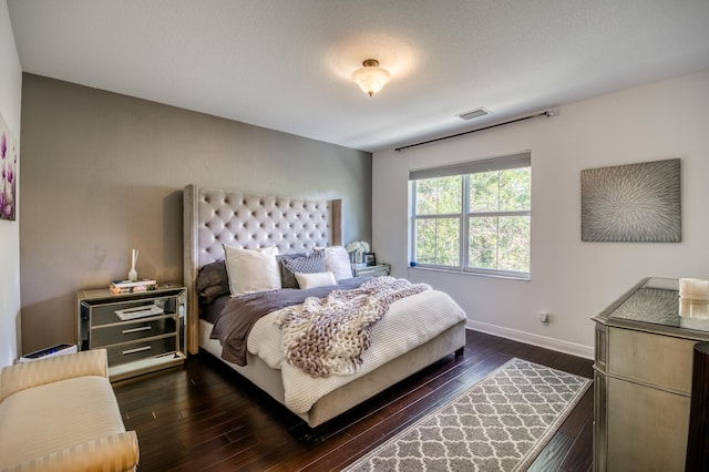 bedroom featuring dark wood-type flooring