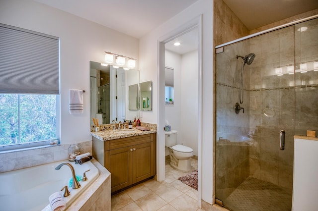 full bathroom with vanity, independent shower and bath, toilet, and tile patterned floors