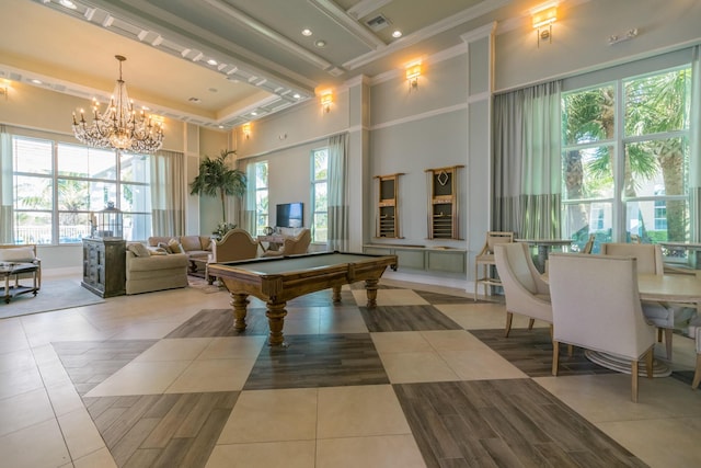 game room featuring light tile patterned flooring, a wealth of natural light, and a towering ceiling