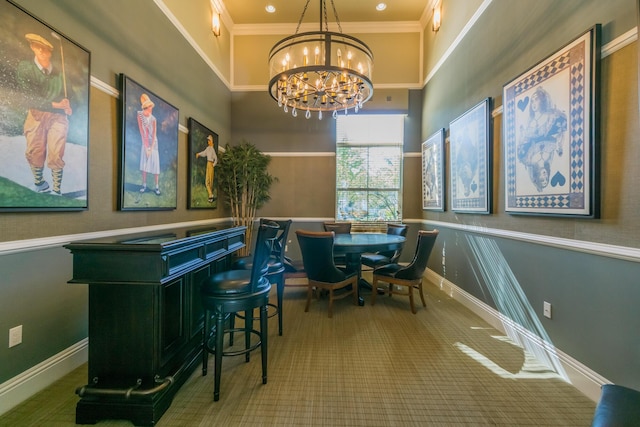 interior space featuring carpet floors, ornamental molding, a towering ceiling, and an inviting chandelier