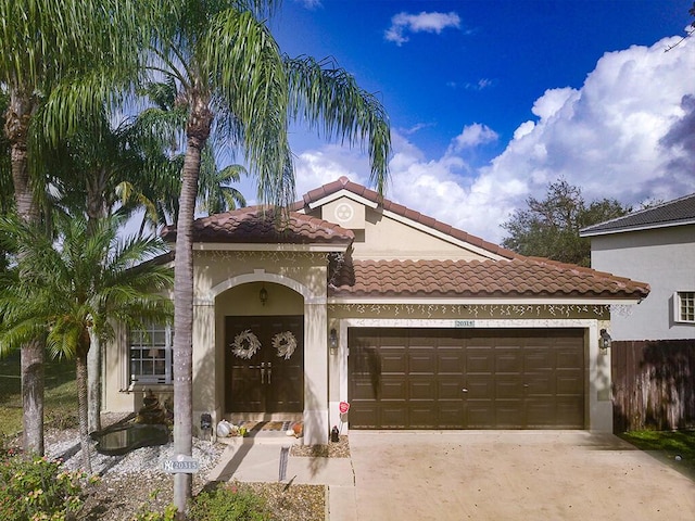 mediterranean / spanish-style home featuring a garage