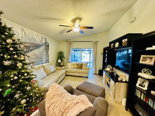 living room with lofted ceiling, light tile patterned floors, a textured ceiling, and ceiling fan