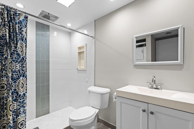 bathroom featuring vanity, toilet, and a shower with shower curtain