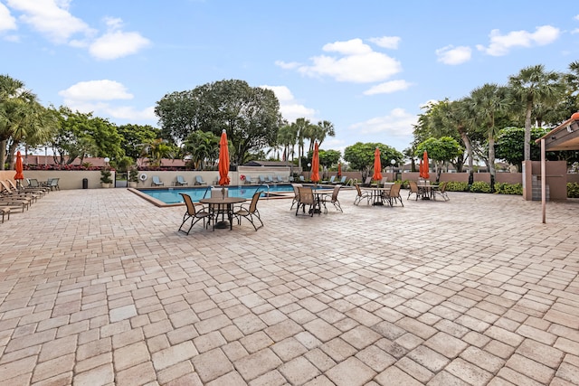 view of swimming pool with a patio area