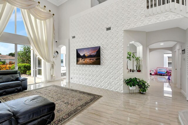 living room with a towering ceiling