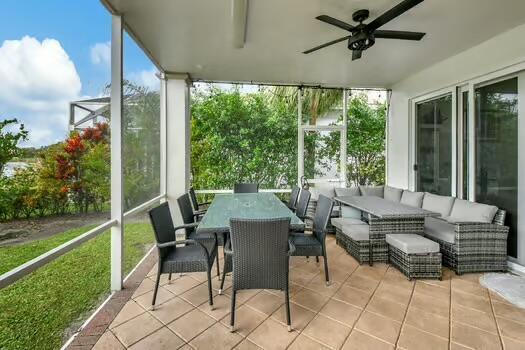 sunroom / solarium with ceiling fan