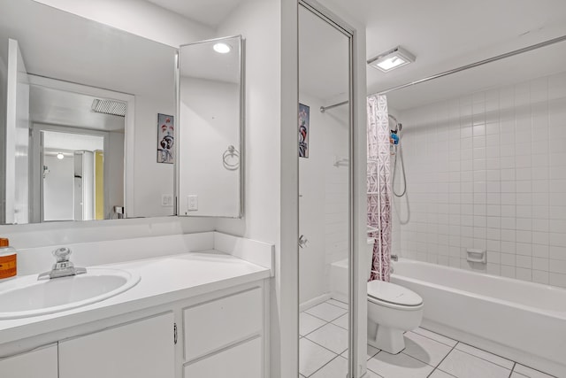 bathroom featuring tile patterned flooring, vanity, toilet, and shower / bath combo