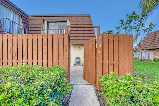 view of gate with fence