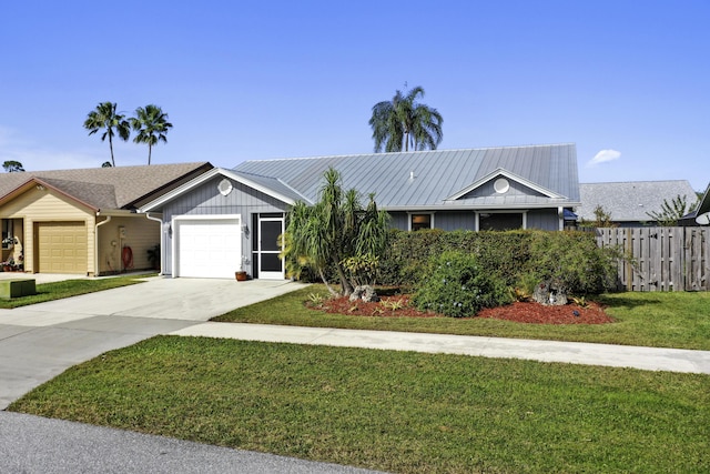 single story home featuring a front yard and a garage