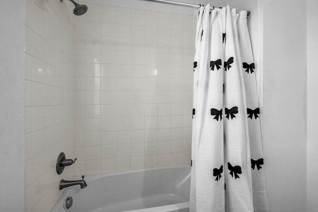 full bath featuring shower / tub combo with curtain