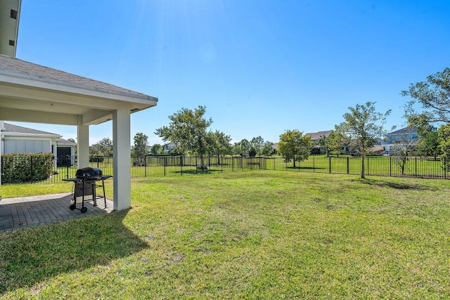 view of yard featuring a patio area and fence