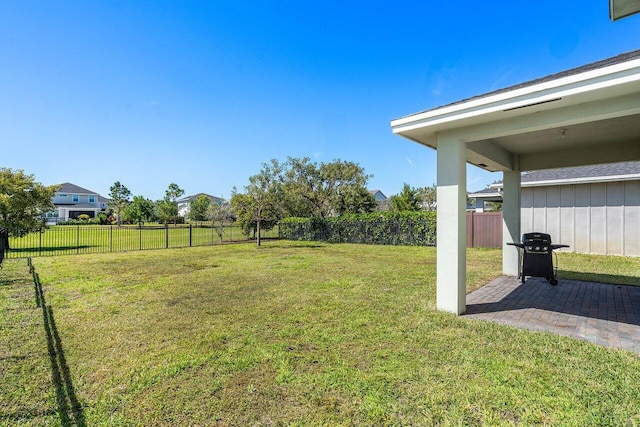 view of yard featuring a patio area and a fenced backyard