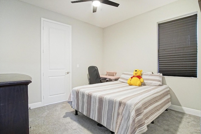 bedroom featuring light carpet and ceiling fan