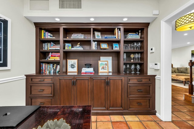 interior space featuring visible vents and light tile patterned flooring