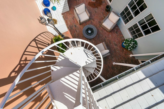 stairway featuring a towering ceiling