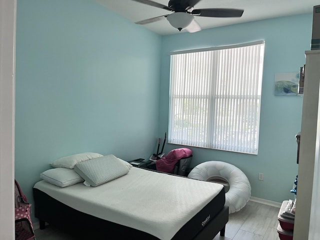 bedroom featuring ceiling fan and light hardwood / wood-style flooring