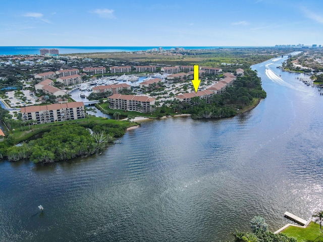 birds eye view of property featuring a water view