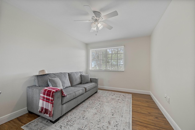 living room featuring hardwood / wood-style flooring and ceiling fan